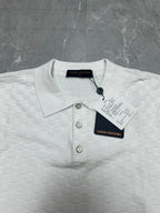 Louis Vuitton white polo shirt close-up: knit texture, three-button placket, round collar