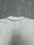 Louis Vuitton white polo shirt back view with raised collar and textured check pattern