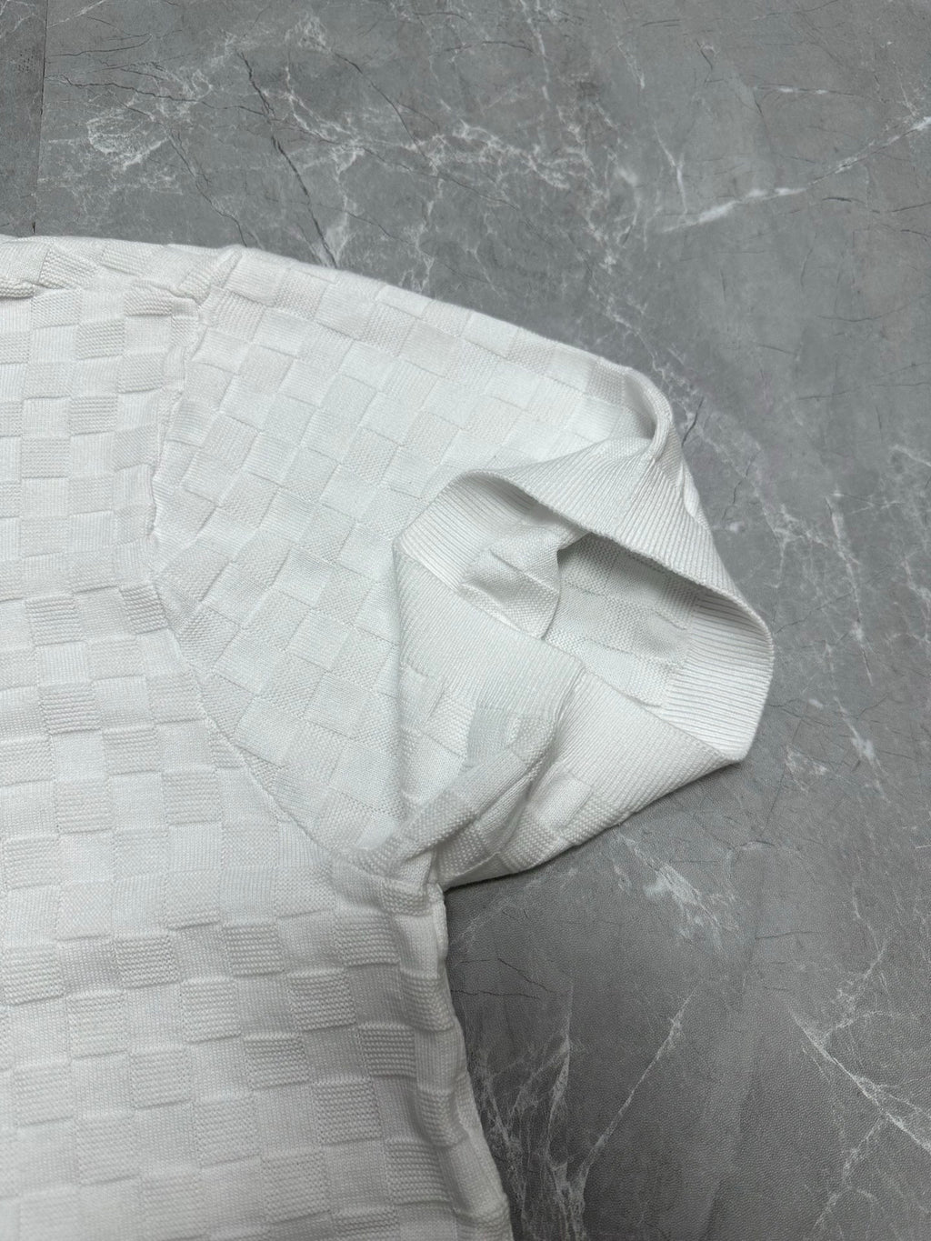 Louis Vuitton white polo shirt shoulder and sleeve seam in textured checker knit