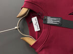 Stone Island polo-style sweatshirt collar with logo patch tag in maroon