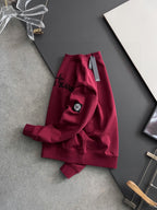 Stone Island maroon tracksuit pants with side logo emblem and waistband tag