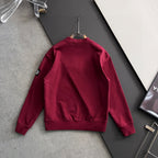 Stone Island crewneck sweatshirt, maroon, back view on hanger