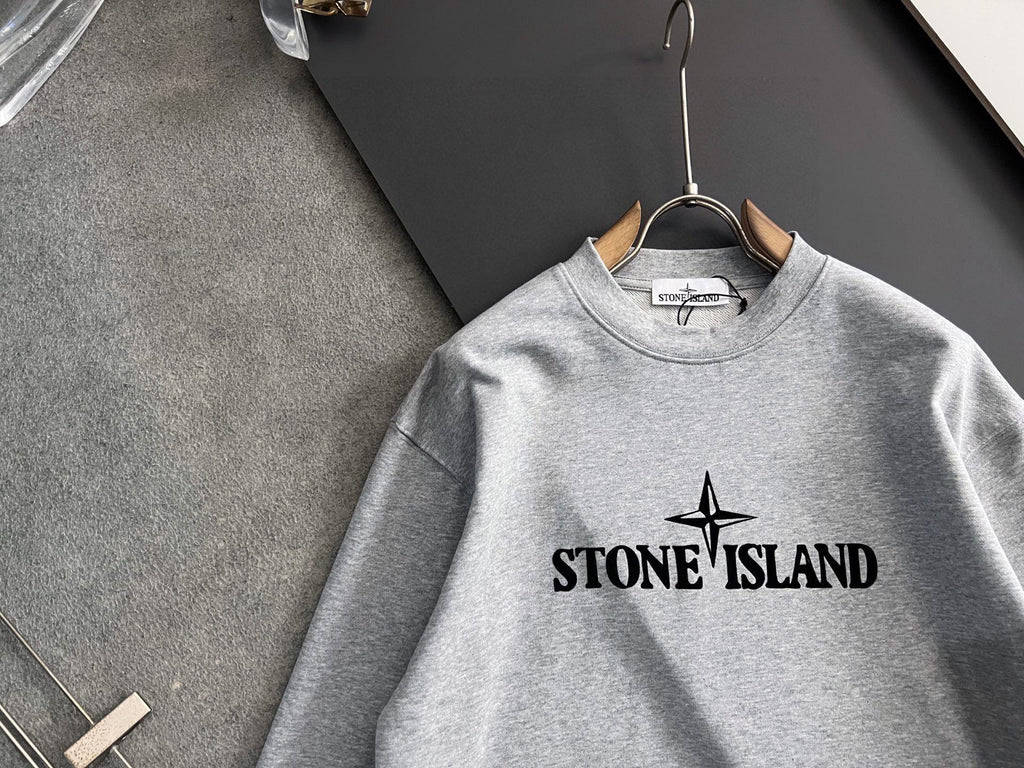 Grey crewneck sweatshirt with Stone Island chest graphic