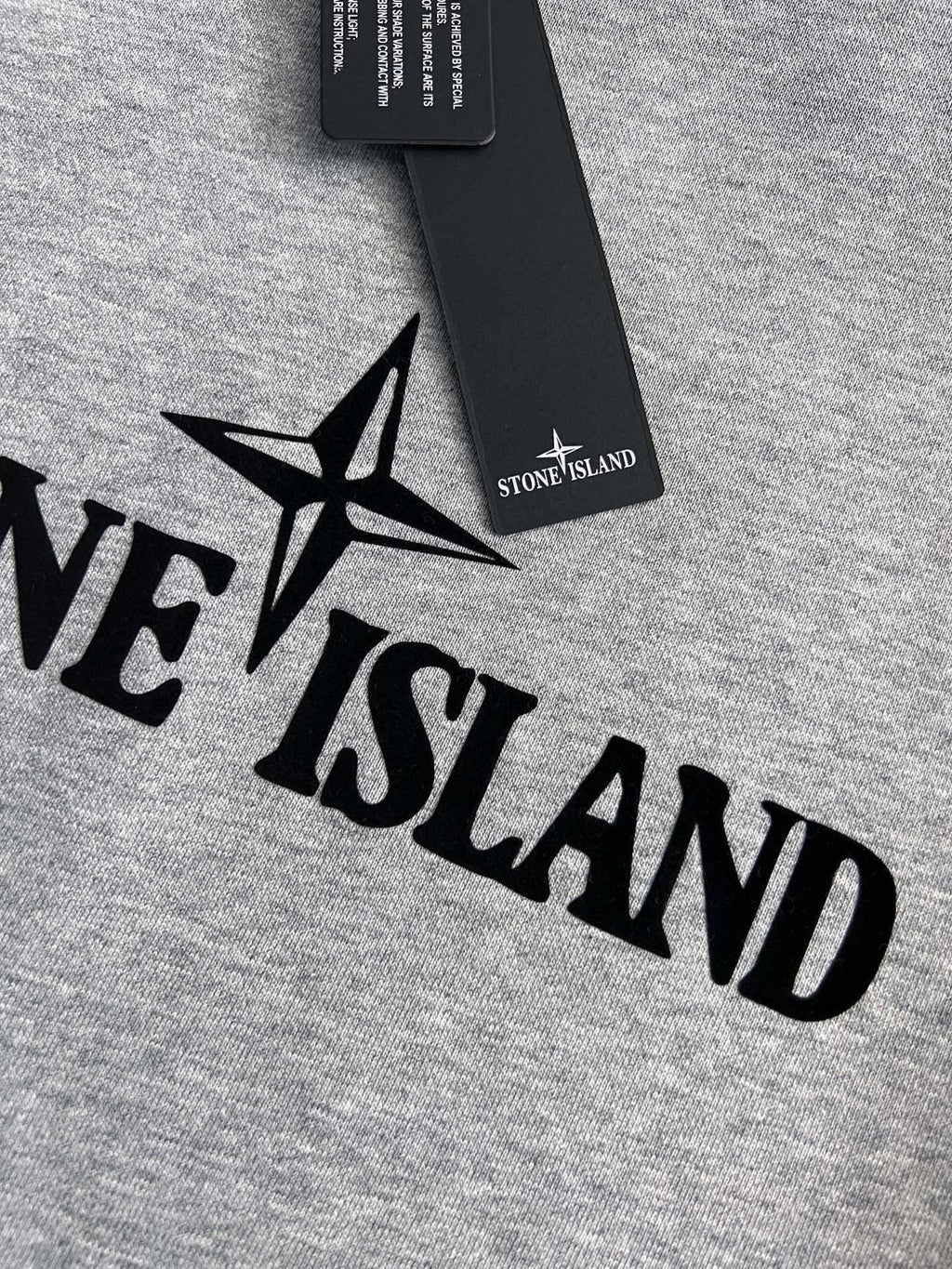 Grey sweatshirt fabric with black star and lettering logo print