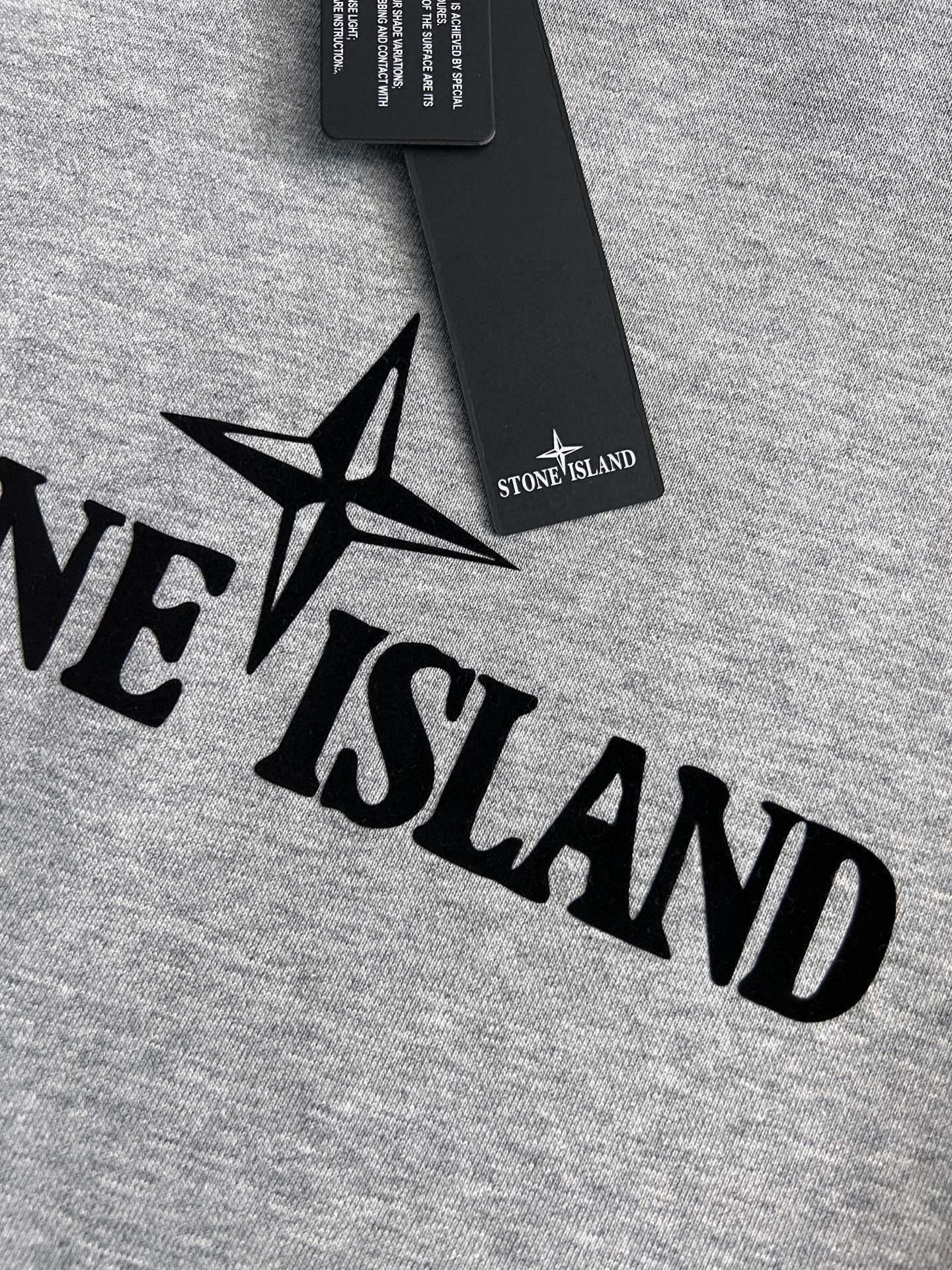 Grey sweatshirt fabric with black star and lettering logo print