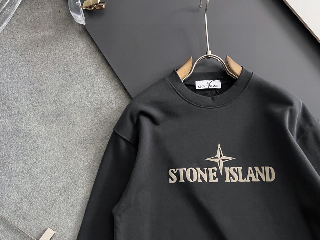 Stone Island sweatshirt close-up, black crewneck with large STONE ISLAND graphic