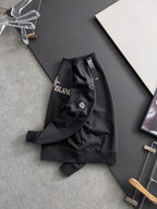 Stone Island sweatshirt side view, black with left sleeve crest patch