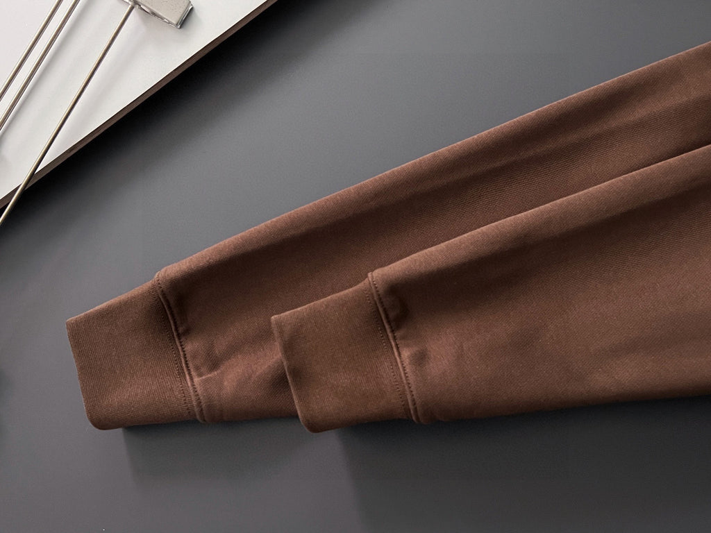 Brown sweatshirt sleeve with elastic cuff and stitched hem