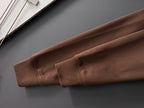 Brown sweatshirt sleeve with elastic cuff and stitched hem