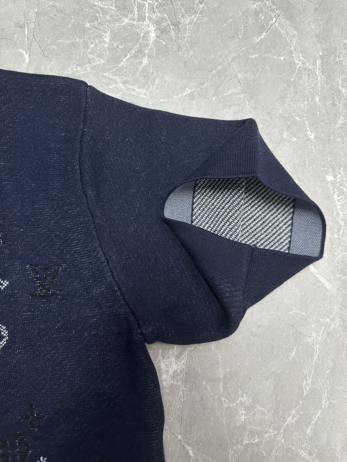 Louis Vuitton navy T-shirt showing striped inner neck lining and ribbed collar