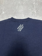 Louis Vuitton navy T-shirt back neck close-up with small white logo graphic