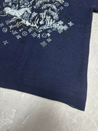 Louis Vuitton navy T-shirt close-up of white graphic print near lower front