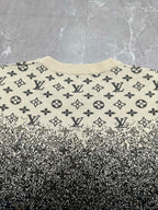 Crewneck sweater front with beige monogram print and dark speckled gradient