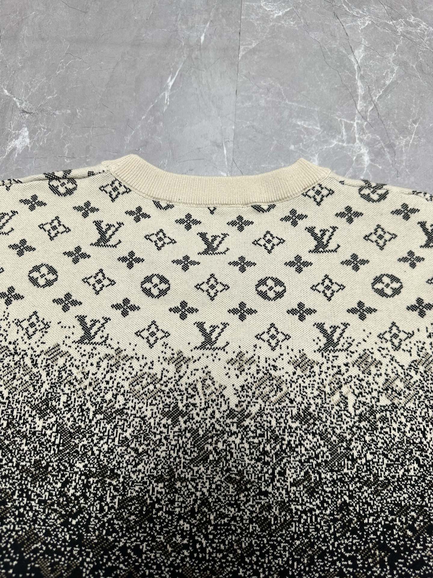 Crewneck sweater front with beige monogram print and dark speckled gradient