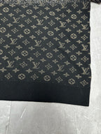 Lower front panel of monogram sweater in dark navy with scattered beige symbols