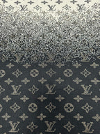 Close-up knit fabric with LV-style monogram pattern in dark navy and beige