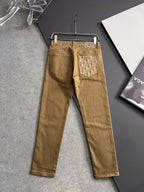Olive Dior jeans on hanger, full length with logo back pocket patches
