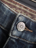 Blue denim jeans coin pocket with round metal logo button