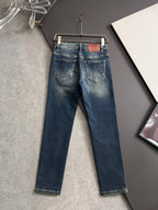 Blue denim jeans on hanger, back view with two rear pockets