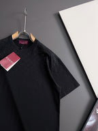 Black Gucci short-sleeve top with crew neck and textured allover pattern