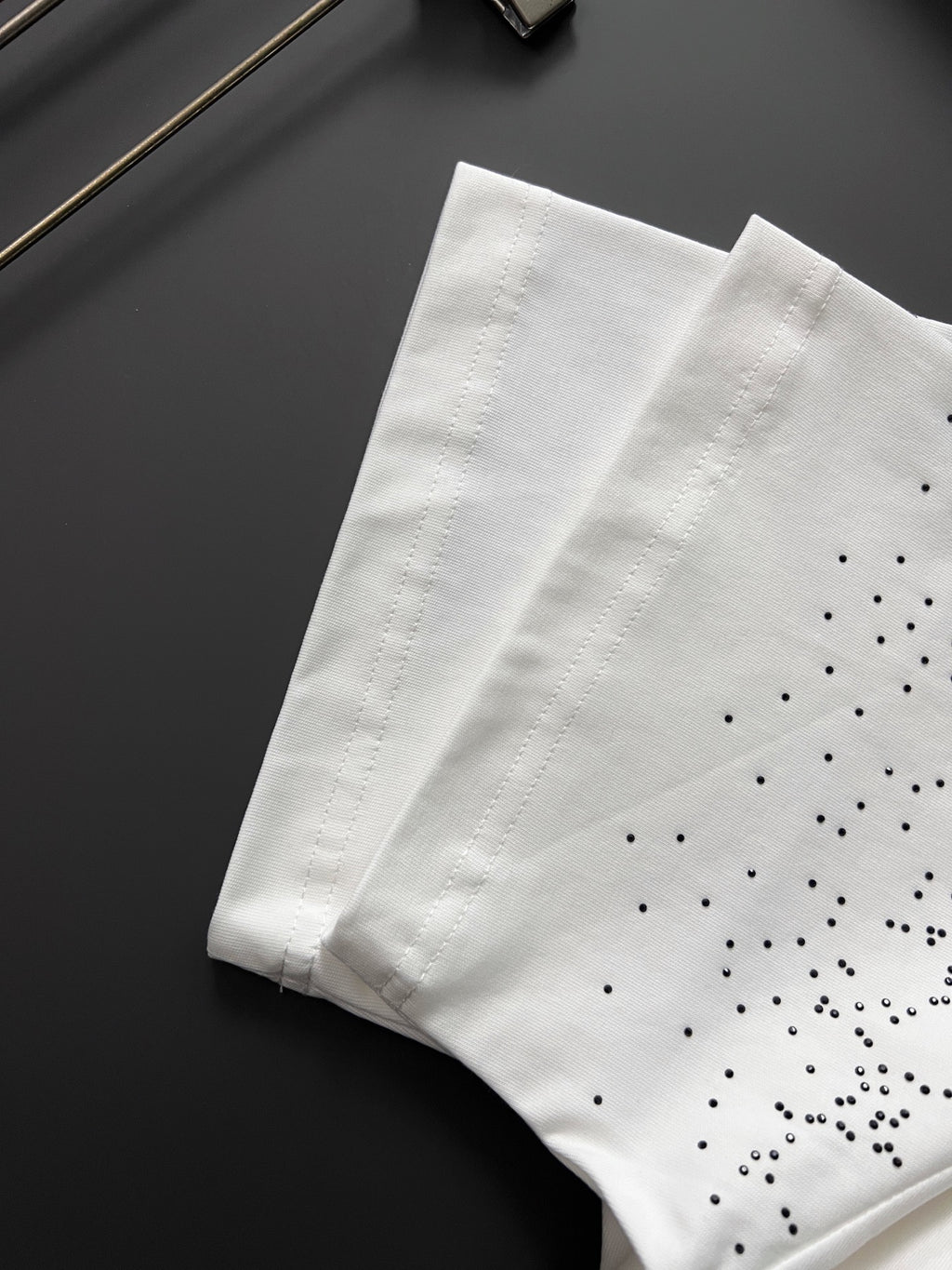White Gucci T-shirt with GG pattern dot details, folded