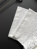 White Gucci T-shirt with GG pattern dot details, folded