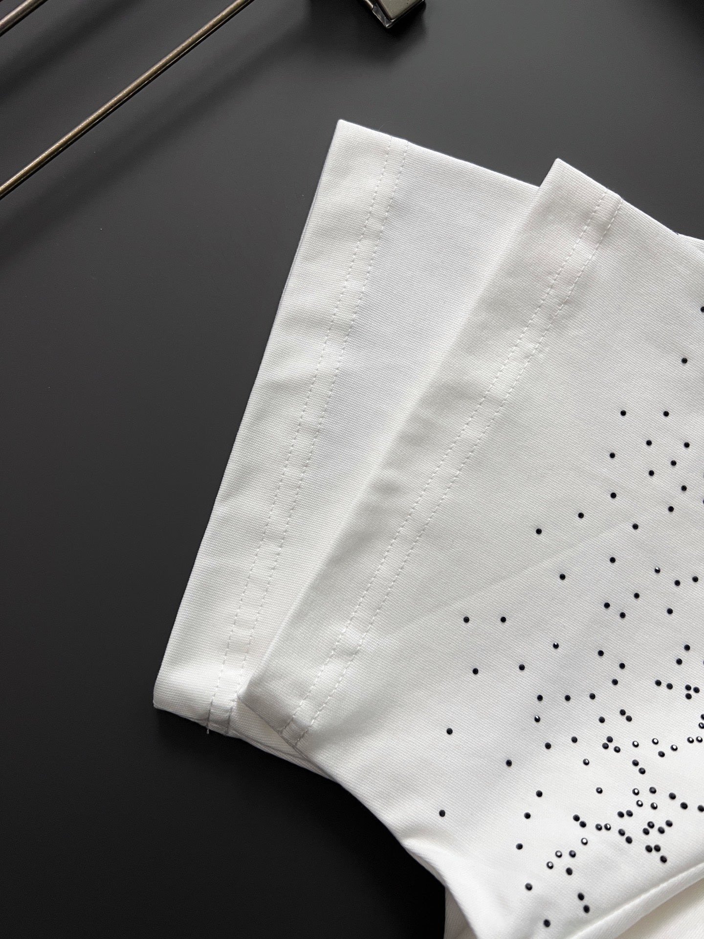 White Gucci T-shirt with GG pattern dot details, folded
