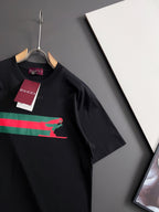Black short-sleeve T-shirt with multicolor stripe and green Puma graphic