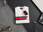 White short-sleeve T-shirt with multicolor stripe and green dog graphic, Gucci tag