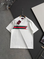 White short-sleeve T-shirt with multicolor stripe and green dog graphic, hanging tags