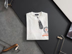 White short-sleeve T-shirt on hanger with front crest graphic and tag