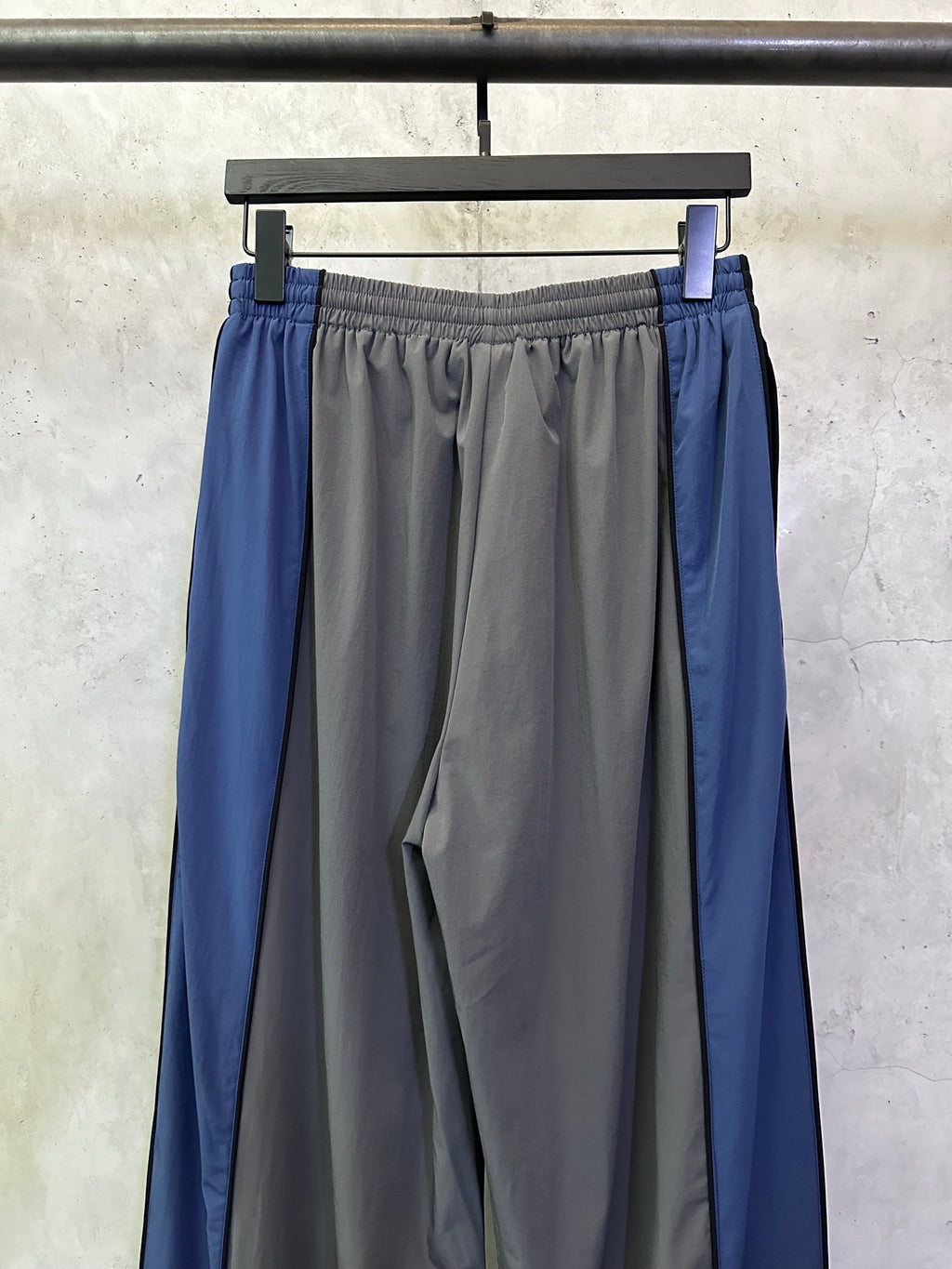 Blue side panel track pants with elastic waist and gathered front