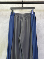 Blue side panel track pants with elastic waist and gathered front