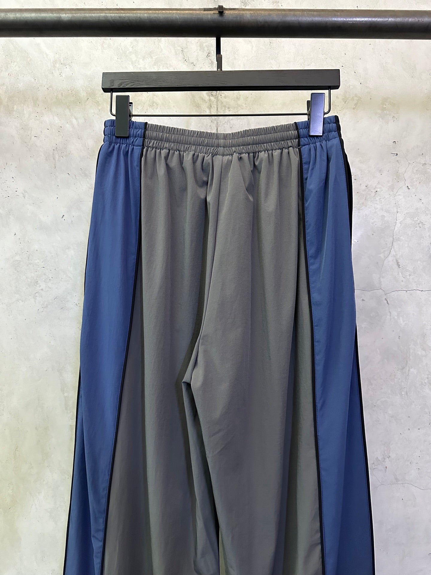 Blue side panel track pants with elastic waist and gathered front