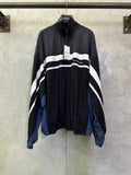 Balenciaga zip jacket with white wave stripes, black body, blue side panels