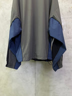 Balenciaga zip jacket back view, dark gray with blue panel cuffs and draped sleeves