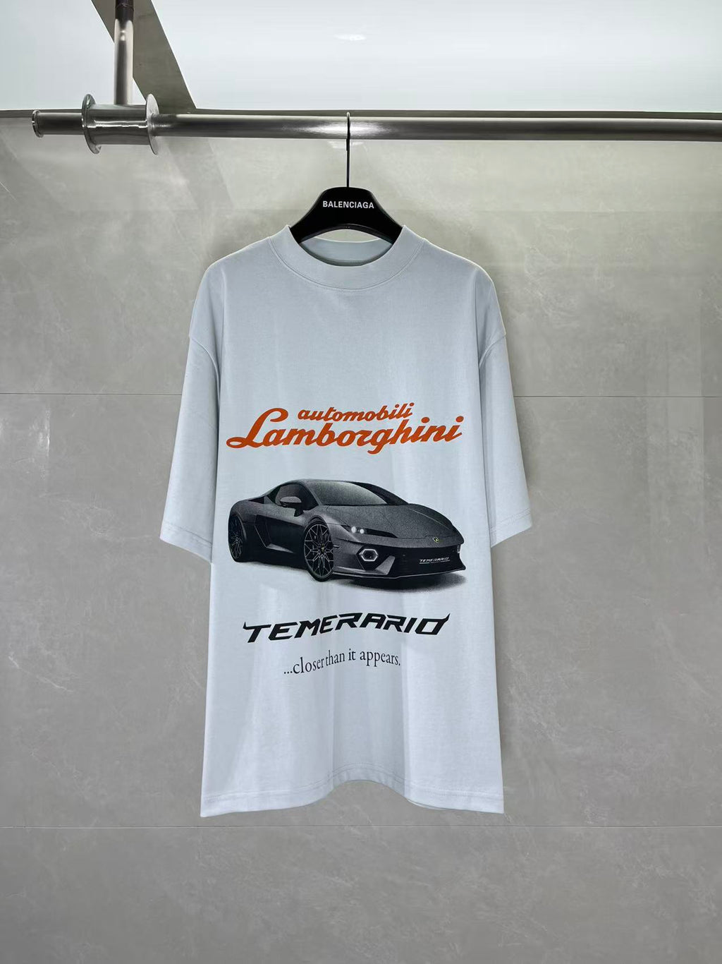 Light blue short-sleeve T-shirt with Lamborghini and car graphic print