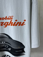 Light blue T-shirt front with orange Lamborghini text and car graphic