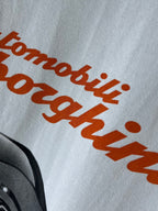 Light blue T-shirt with orange Lamborghini script-style text