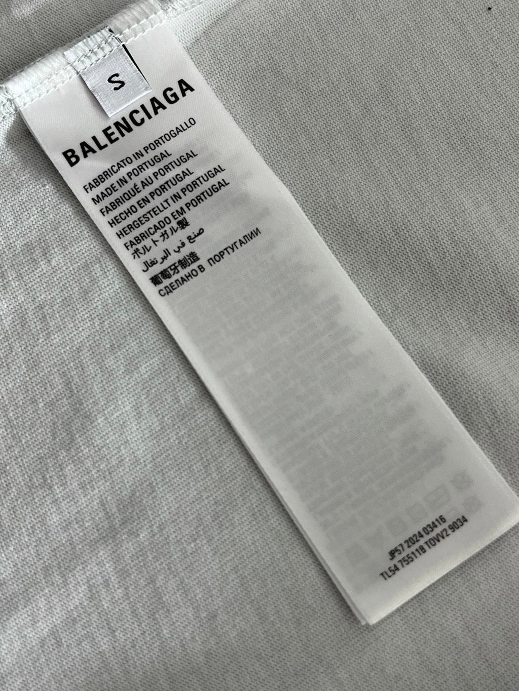 White fabric care label with BALENCIAGA and product material details