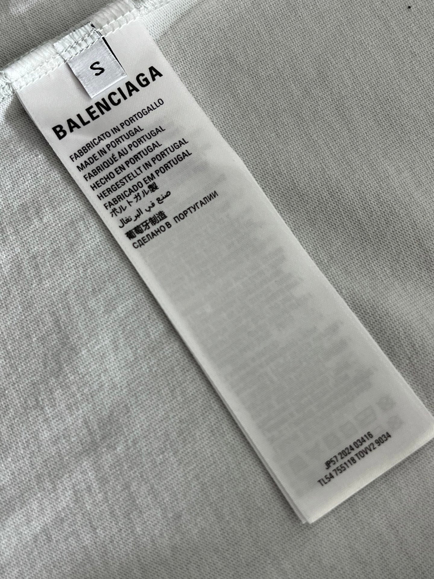 White fabric care label with BALENCIAGA and product material details