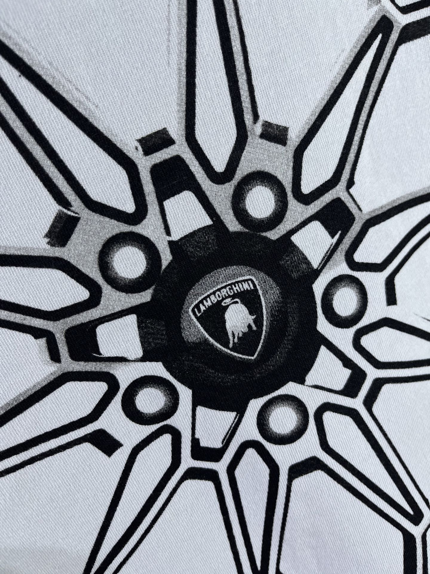 Light blue T-shirt with black wheel graphic and Lamborghini emblem