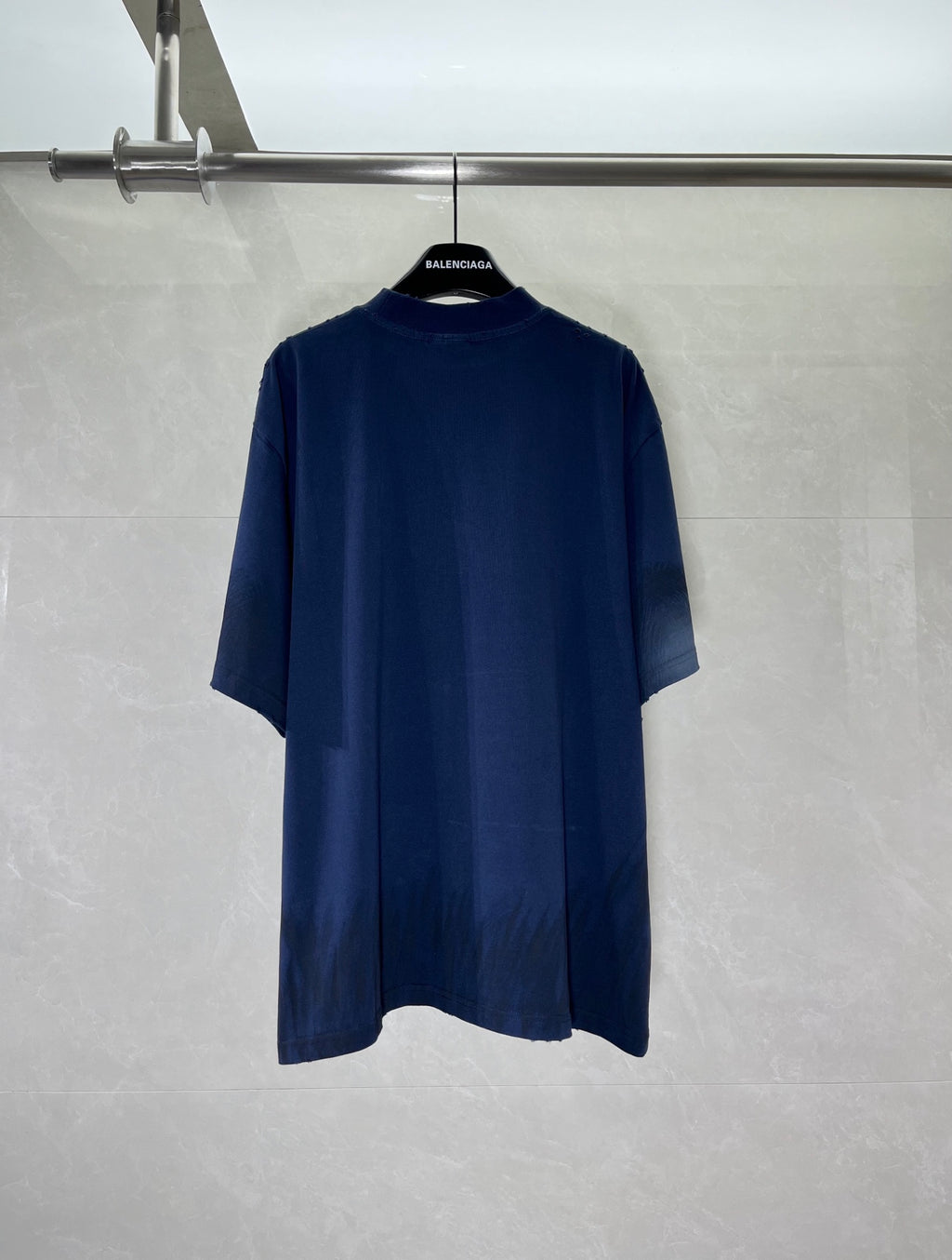 Navy crew-neck T-shirt on hanger with plain back