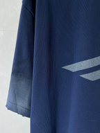 Navy T-shirt with grey graphic on side and wide, draped hem