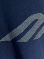 Navy T-shirt showing grey graphic close-up