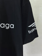 Dark navy T-shirt sleeve detail with 'balenciaga' and geometric mark