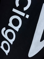 Dark navy T-shirt close-up of 'balenciaga' and large swoosh graphic