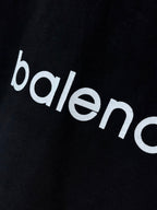 Dark navy T-shirt close-up of 'balenciaga' wordmark