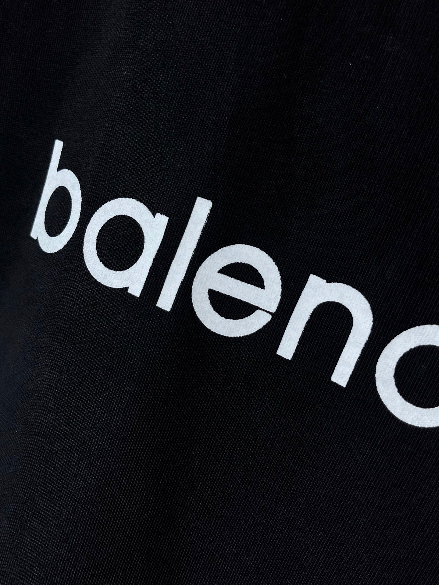 Dark navy T-shirt close-up of 'balenciaga' wordmark