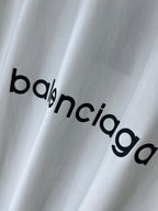White T-shirt with large Balenciaga wordmark print across the fabric